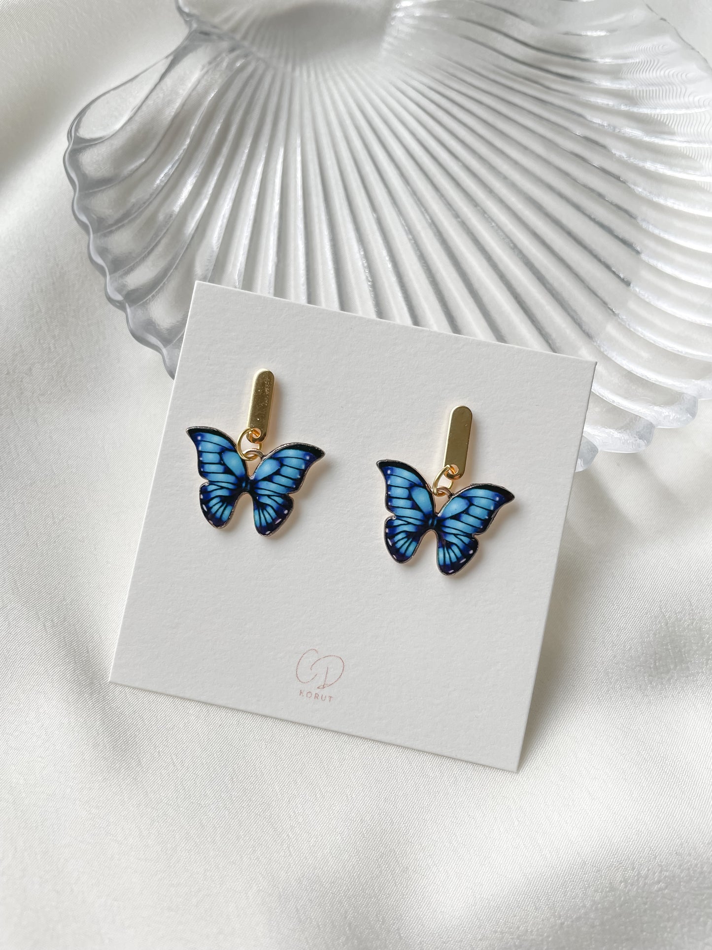 Korvakorut sininen perhonen